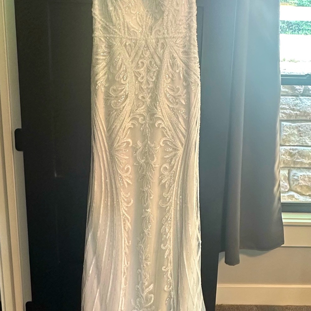 Wedding dress by Maggie Sottero Designs.